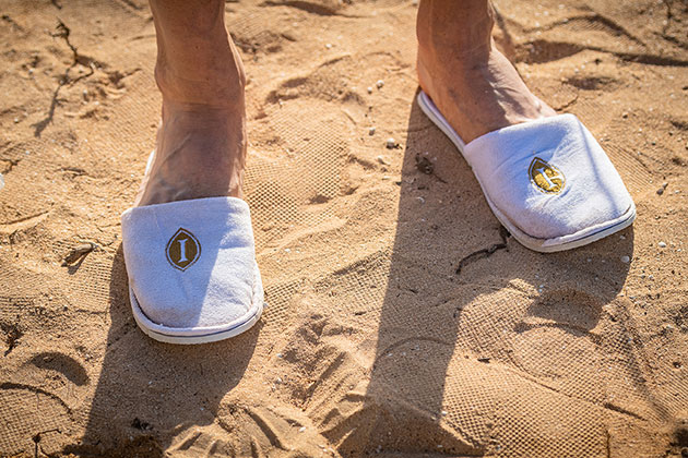 Zoom on some Playitas Resort slippers at the bivouac
