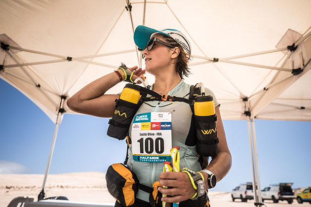 Photo of a participant with her backpack at one of the checking point